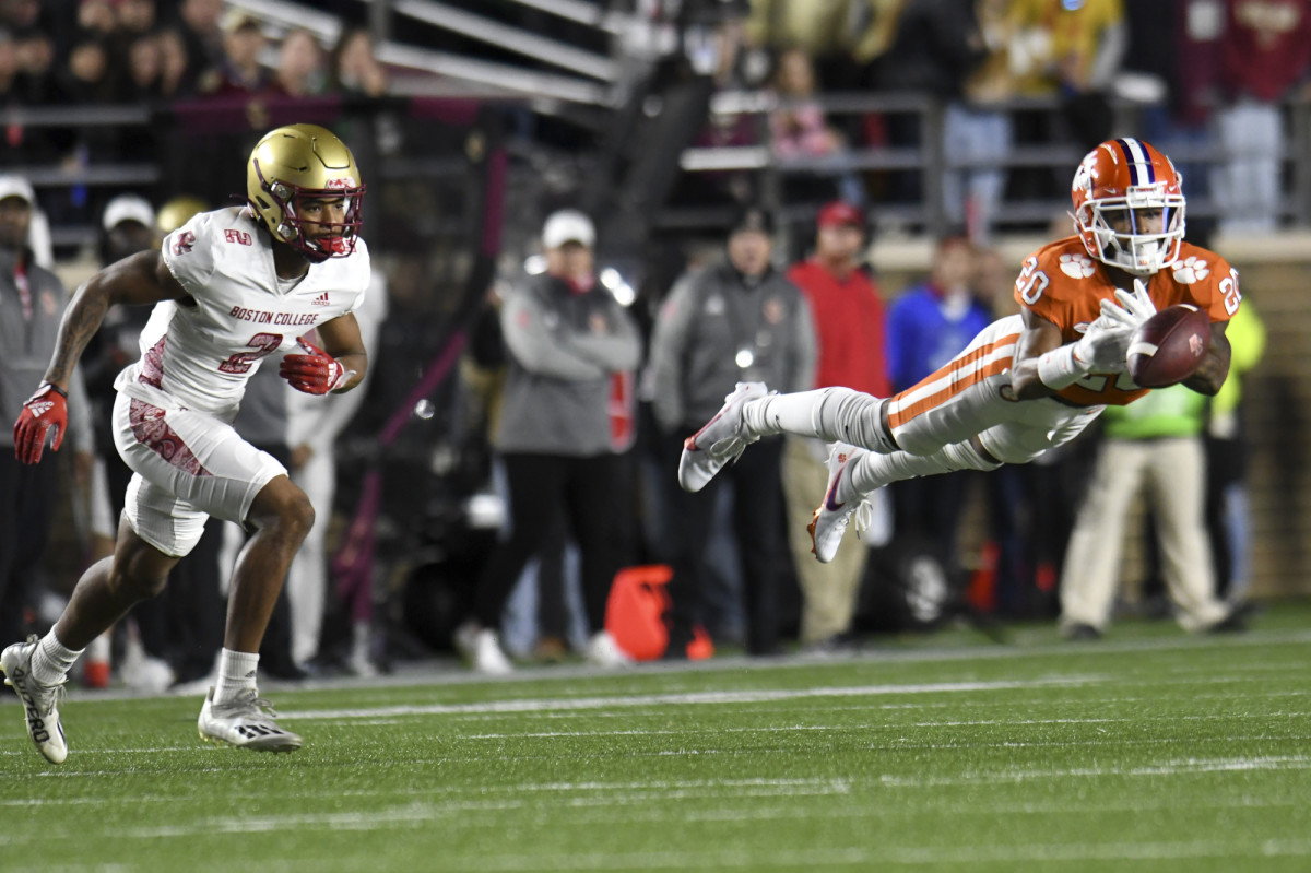 Clemson’s Nate Wiggins tries to intercept a pass intended for Boston College’s Joseph Griffin.